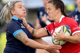 Borderer Chloe Rollie tackling Ffion Lewis during Scotland's 18-15 pool A defeat by Wales on Sunday at the New Zealand 2021 Women's Rugby World Cup at Northland Events Centre in Whangarei (Photo by Michael Bradley/AFP via Getty Images)