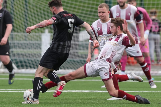 Graeme Clark tackling Michael Stewart during Langlee Amateurs' 4-1 victory at home to Duns Amateurs at Netherdale on Saturday to go back to the top of the Border Amateur Football Association's A division (Photo: Brian Sutherland)