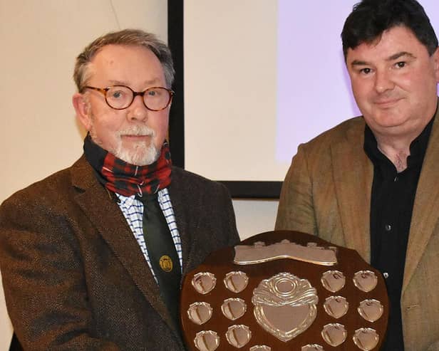 Selkirk Merchant Company Master Alistair Pattullo (left) presents the 2021 award to Gethin Chamberlain. Photo: John Smail.