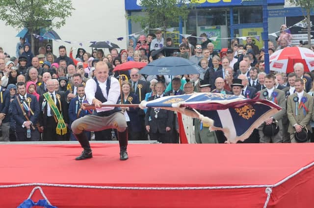 A bit of rain can't wipe the smile off Adam's face as he performs the casting.