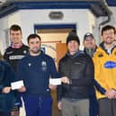 Patrick Macdonell, Jane Macdonell, Andrew McColm, campaign organiser Aaron McColm, Michael Jaffray, Darren Hoggan and Liam Cassidy at the cheque handover at Selkirk Rugby Club (Photo: John Smail)