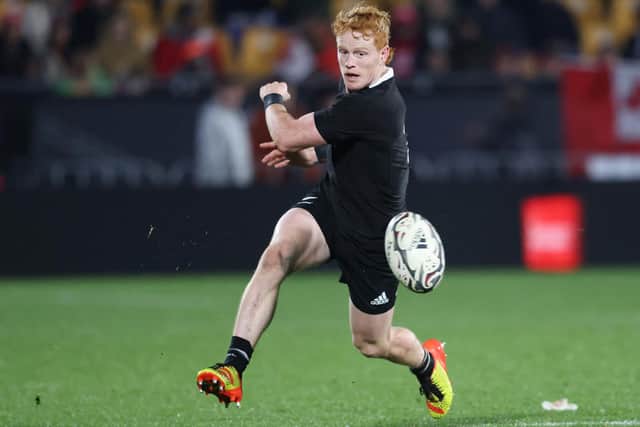 Finlay Christie kicking the ball during the test match between the New Zealand All Blacks and Tonga in Auckland last Saturday, July 3 (Photo by Michael Bradley/AFP via Getty Images)