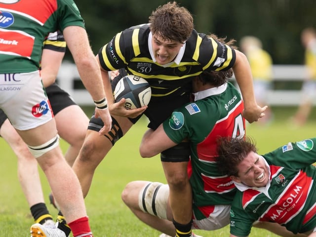 Sam Derrick on the ball for Melrose, being tackled by Adam Kerr, during their 34-31 win away to Glasgow Hutchesons’ Aloysians on Saturday (Photo: Andy McLean)