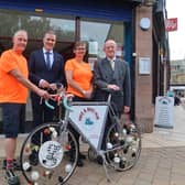 Business Minister Tom Arthur, Angela Crow of Hike & Bike Hub and SOSE's Russel Griggs.
