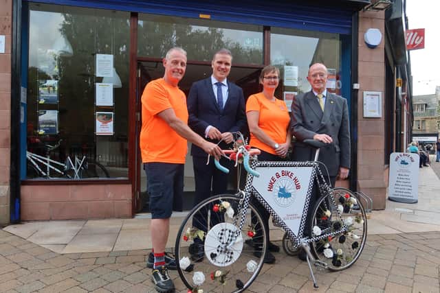 Business Minister Tom Arthur, Angela Crow of Hike & Bike Hub and SOSE's Russel Griggs.