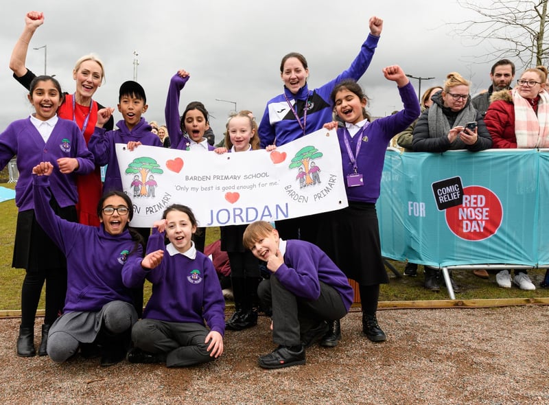 Barden Primary School pupils cheered Jordan North on from the canal. Photo: Kelvin Stuttard