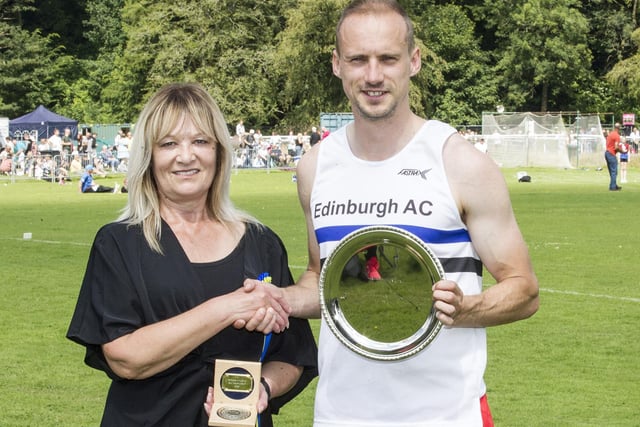 Allan Hamilton receives the Silver Salver from Anne Crawford after winning the 90m UK Sprint Championship