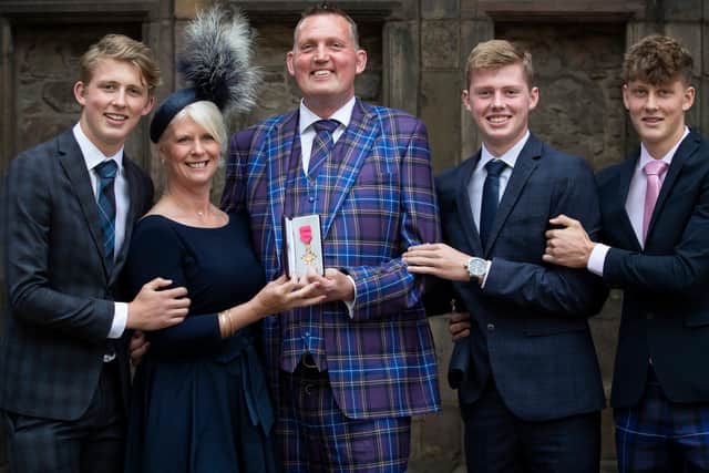 Former Scotland rugby international Doddie Weir with wife Kathy and their three sons, from left, Hamish, Ben and Angus after being given his Order of the British Empire by the late Queen Elizabeth II in July 2019 in Edinburgh (Photo by Jane Barlow/WPA pool/Getty Images)