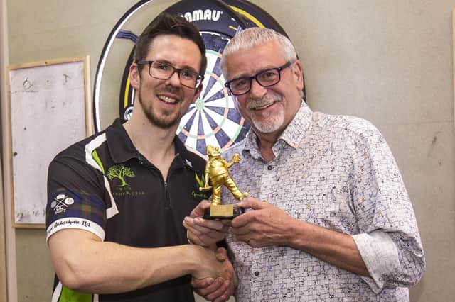 Grant Murray, left, being presented with his trophy at Jedburgh's Royal British Legion Club by former darts star Jim McGuigan (Photo: Bill McBurnie)