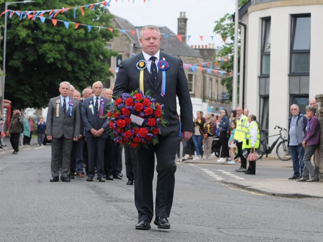 Ex Standard bearers chairman Scott Tomlinson makes his way to lay the wreath at the Flodden Memorial.