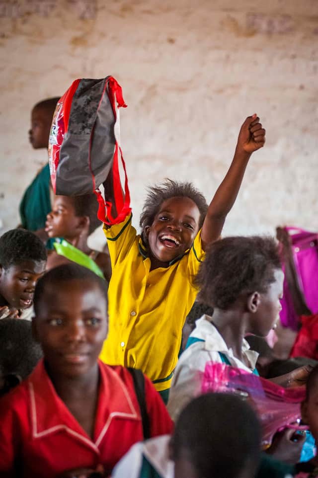 Malawi pupil Martha Payne is delighted with her backpack.