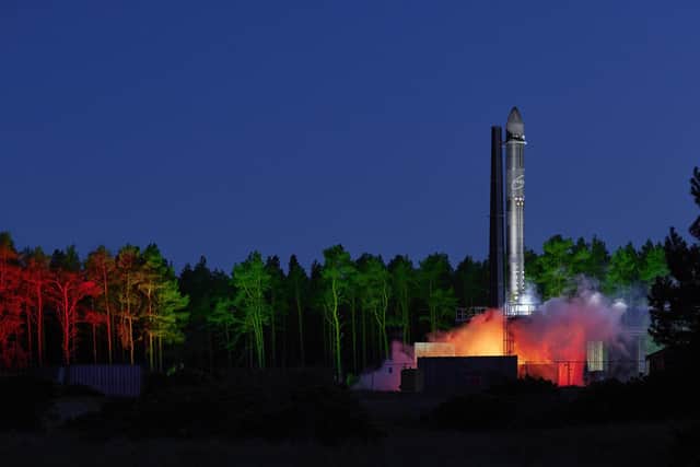 Test-firing the rocket's engines lights up the night skies