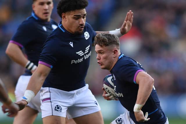 Darcy Graham, right, evading Tonga's Kurt Morath at Murrayfield Stadium in Edinburgh on Saturday (Photo by Neil Hanna/AFP via Getty Images)