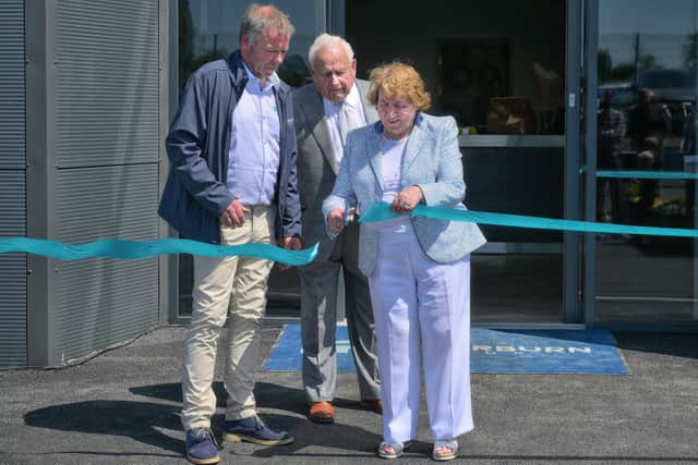 Lady Campbell cuts the ribbon at the opening.