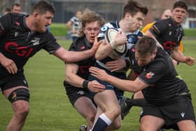 Southern Knights players joining forces to halt a Heriot's attack on Saturday at Goldenacre (Photo: Jonathan Cruickshank)
