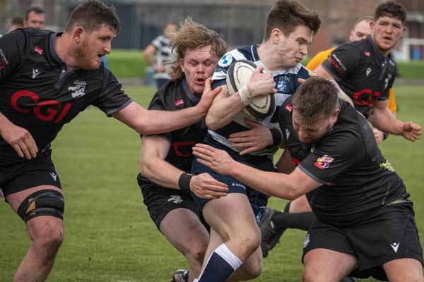 Southern Knights players joining forces to halt a Heriot's attack on Saturday at Goldenacre (Photo: Jonathan Cruickshank)