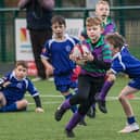 Lachlan Graham in action for Wilton Primary at Hawick's youth rugby festival on Friday