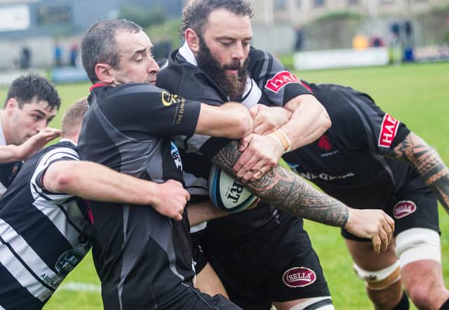 Biggar's Davie Reive trying to get to grips with Kelso's Bruce McNeil (Photo: Bill McBurnie)