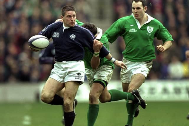 Scotland's Alan Tait being tackled by Ireland's Dion O'Cuinneagain during a 30-13 Five Nations win for the hosts at Edinburgh's Murrayfield Stadium (Pic: Jamie McDonald/Allsport/Getty Images)
