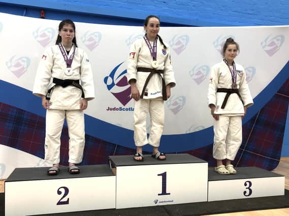 Sportif's Maia Thomson on gold medal podium
