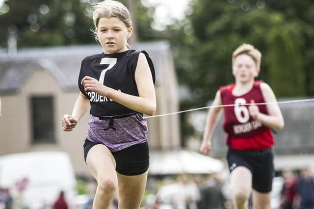 Hawick's Carra McLeod winning a youths' 200m heat at Selkirk Border Games