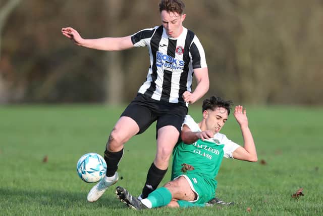 Rodrigo Olival tackling Luke McKinlay during Hawick Legion's 5-1 win at home to Kelso Thistle in the second round of this season's South of Scotland Amateur Cup (Photo: Brian Sutherland)
