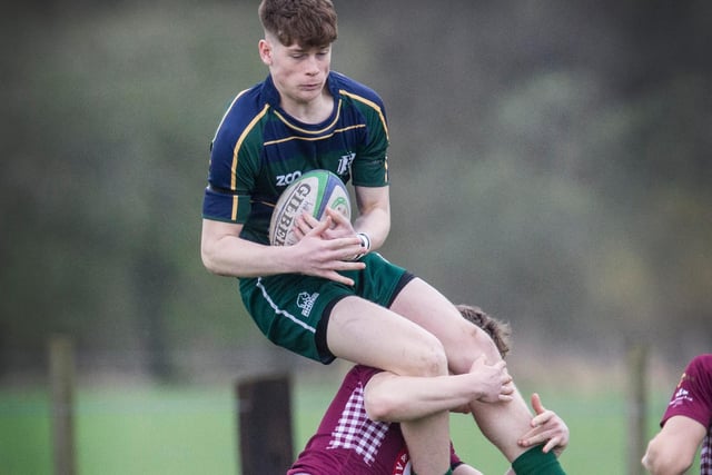 Hawick Youth's Rory Stanger being flipped upside down by an illegal tackle by Gala Wanderers