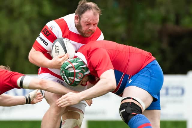 South of Scotland's Nicky Little being tackled by Caledonia Reds during Sunday's inter-district championship final at Braidholm in Glasgow (Photo by Euan Cherry/SNS Group/SRU)