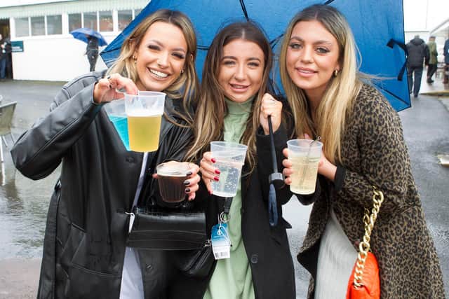 Hawick's Neve Deeks, Brooke Hogg and Erica Duncan defying adverse weather to enjoy a day out at the races (Photo: Bill McBurnie )