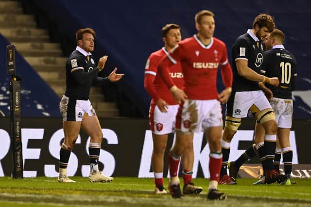 Stuart Hogg of Scotland celebrates touching down for his team's third try during the Guinness Six Nations match between Scotland and Wales at Murrayfield on February 13, 2021, in Edinburgh. (Photo by Stu Forster/Getty Images)