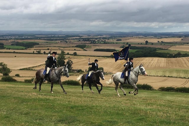 Coldstreamer Harry Shepherd leading his right and left hand men Jake Kerr and Christopher Lyons as the principals crest Branxton Hill.