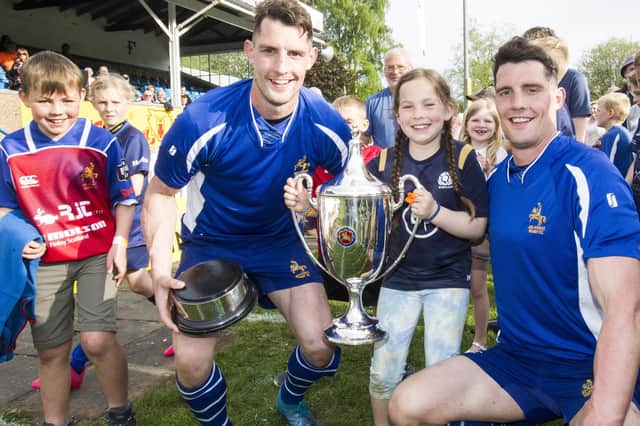 Roddy and May Rutherford celebrating with Jed-Forest's Gregor and Lewis Young on Saturday (Pic: Bill McBurnie)