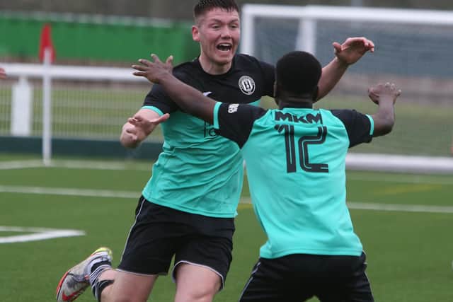 Gala Fairydean Rovers defender Aidan Cassidy celebrating his last-gasp equaliser against Caledonian Braves with Gospel Ocholi, right (Pic: Steve Cox)