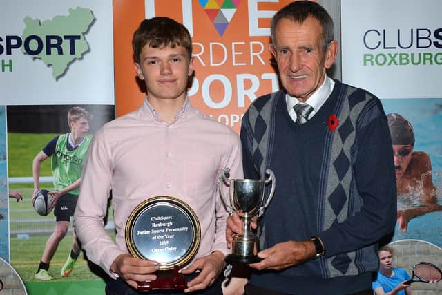 Oscar Onley being presented with ClubSport Roxburgh's award for junior sports personality of the year by David Lang in 2019 (Photo: Alwyn Johnston)