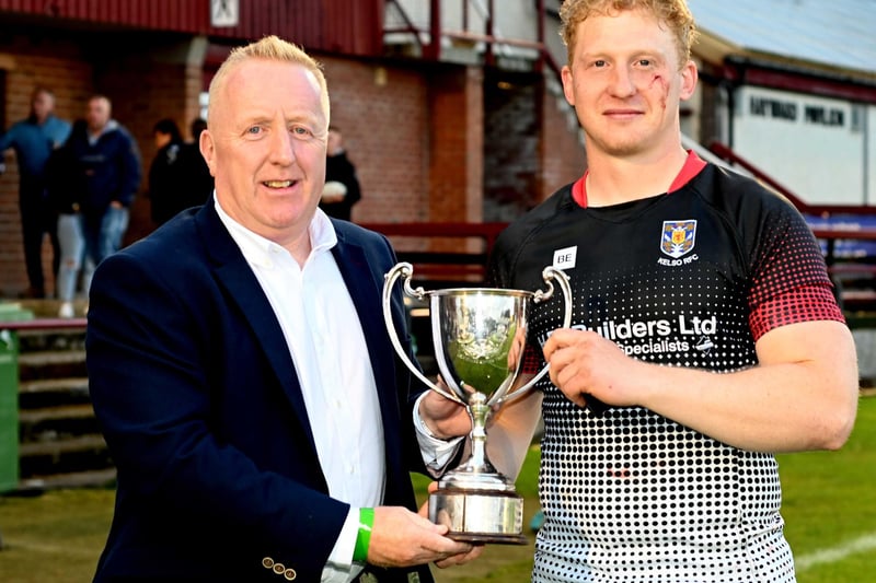 Kelso captain Frankie Robson  being given the winners' cup at Gala Sevens