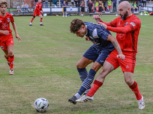 Kyle Kivlichan in action for Vale of Leithen, holding off Bob Boyd, during their 3-2 defeat hosting Hawick Royal Albert on Saturday (Photo: Hilary Isaac)