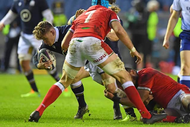 Scotland wing Darcy Graham being tackled during the Six Nations international rugby union match between Scotland and Wales at Murrayfield Stadium in Edinburgh on February 13 (Photo by Andy Buchanan/AFP via Getty Images)