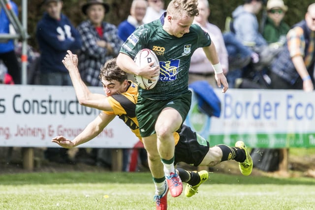 Finlay Douglas on the ball for Hawick against Currie at Jed-Forest Sevens