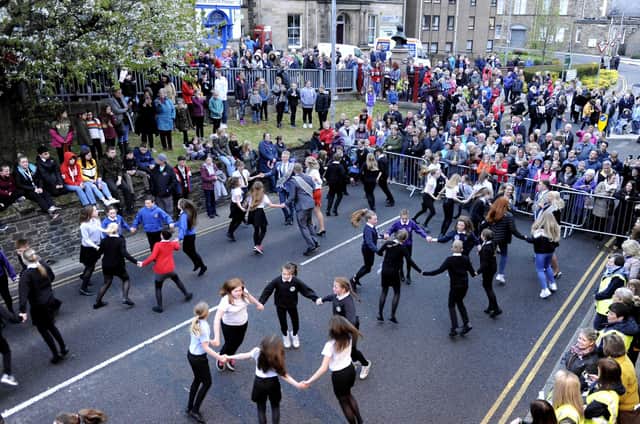 Principals and school children dance outside the Burgh Chambers on declaration night in 2019.