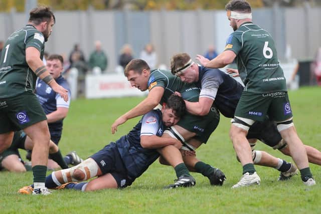 Selkirk's James Bett and Andrew Cochrane getting to grips with Hawick's Dalton Redpath at Mansfield Park on Saturday (Photo: Grant Kinghorn)