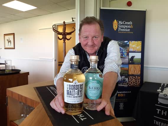 John Fordyce, managing director at Borders Distillery, with two of its products.