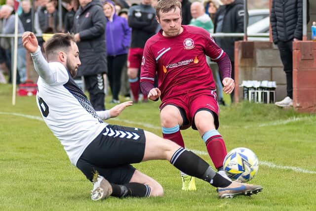 Kelso Thistle getting a tackle in against Eyemouth United Amateurs on Saturday (Pic: Stuart Fenwick)
