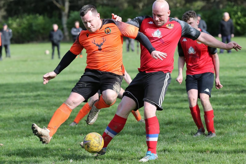 Kevin Strathdee and Stephen Swanston vying for the ball during Hawick United's 4-2 Waddell Cup last-eight loss at home to Newtown on Saturday (Photo: Brian Sutherland)