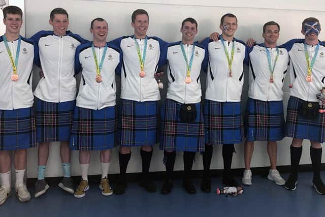 Gregor Swinney, sixth from left, with the full medley relay team line-up that won a bronze medal for Team Scotland