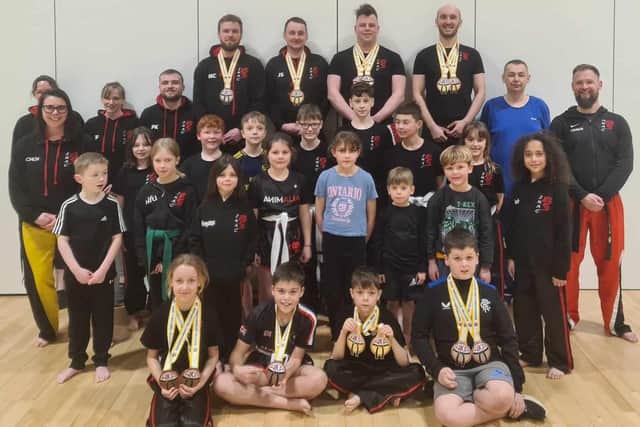 Kickboxing coach Daniel Wilson, far right, with his Jedburgh class, including seven medallists at this month's Wishaw open