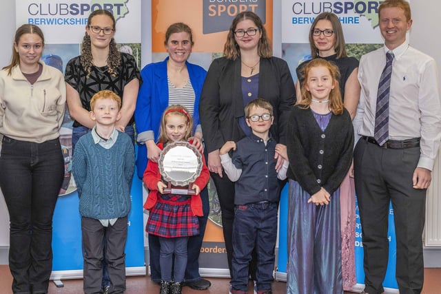 Grantshouse Taekwondo Club being given a special achievement award by ClubSport Roxburgh chairman Colin Dumma for winning 14 medals at the martial art's 2023 Scottish championships in Edinburgh
