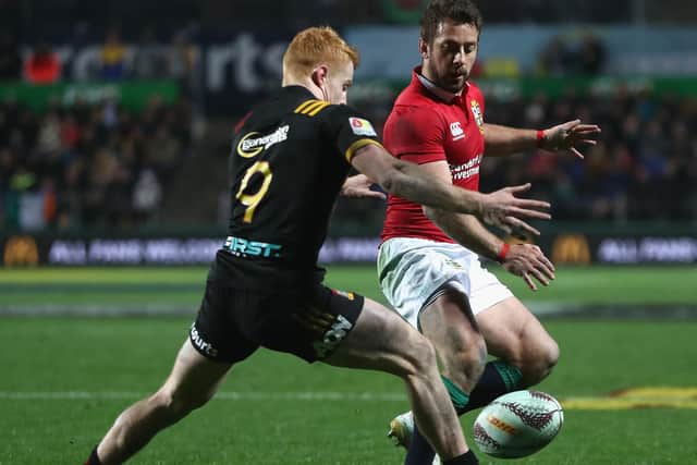 Greig Laidlaw kicks the ball past Finlay Christie during the match between the Chiefs and the British and Irish Lions at Waikato Stadium on June 20, 2017, in Hamilton, New Zealand (Photo by David Rogers/Getty Images)