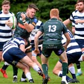 Hawick's Andrew Mitchell being stopped by Trent Storen during his side's 45-33 win against Heriot's Blues on Saturday (Photo: Alwyn Johnston)