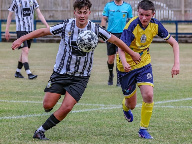 Vale of Leithen under-20s challenging for possession during their first game ever, a 6-1 friendly defeat at home to Dunbar United under-20s last Friday at Victoria Park in Innerleithen (Photo: Hilary Isaac)