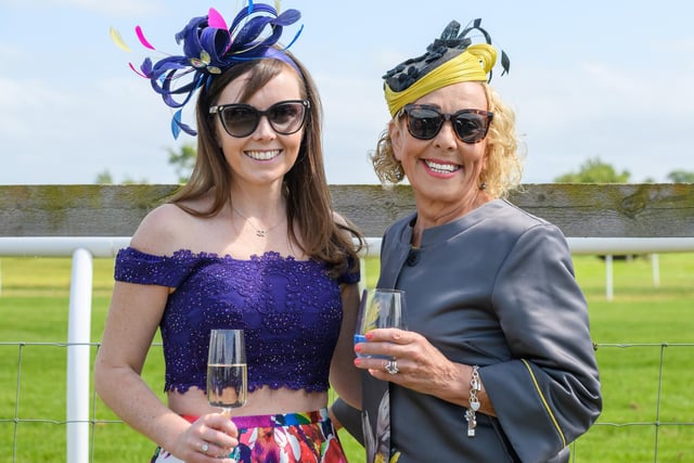 Two race-goers at Kelso's ladies' day season finale on Sunday